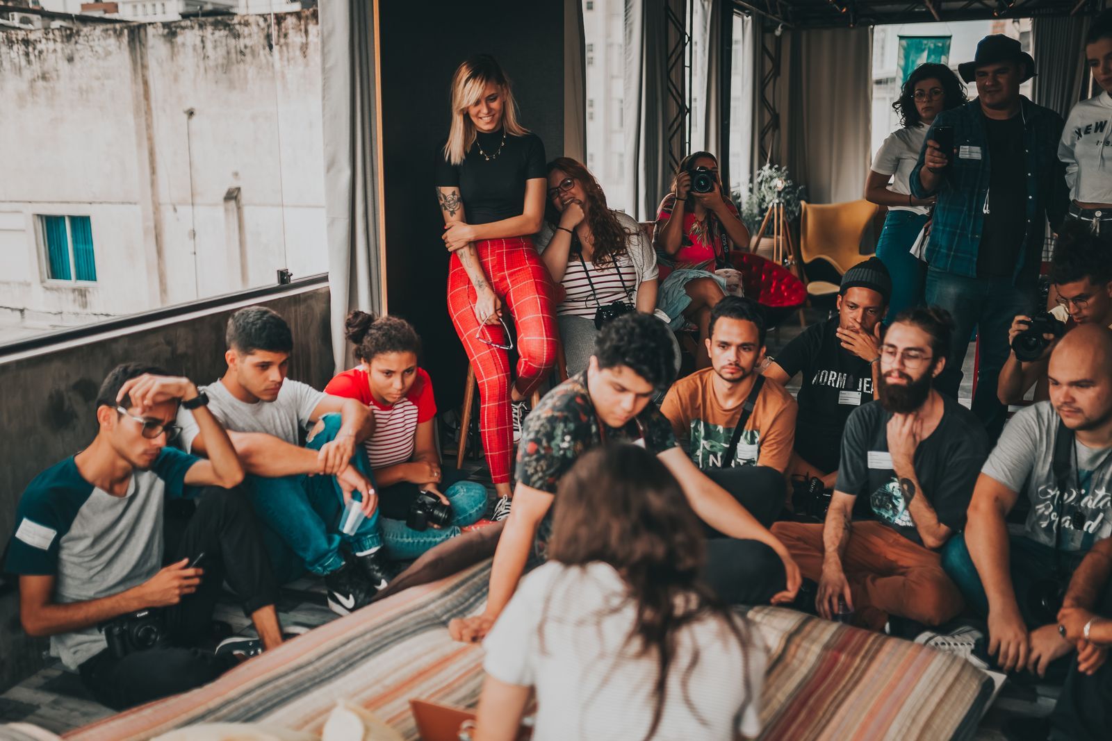 A crowded gathering in a warehouse