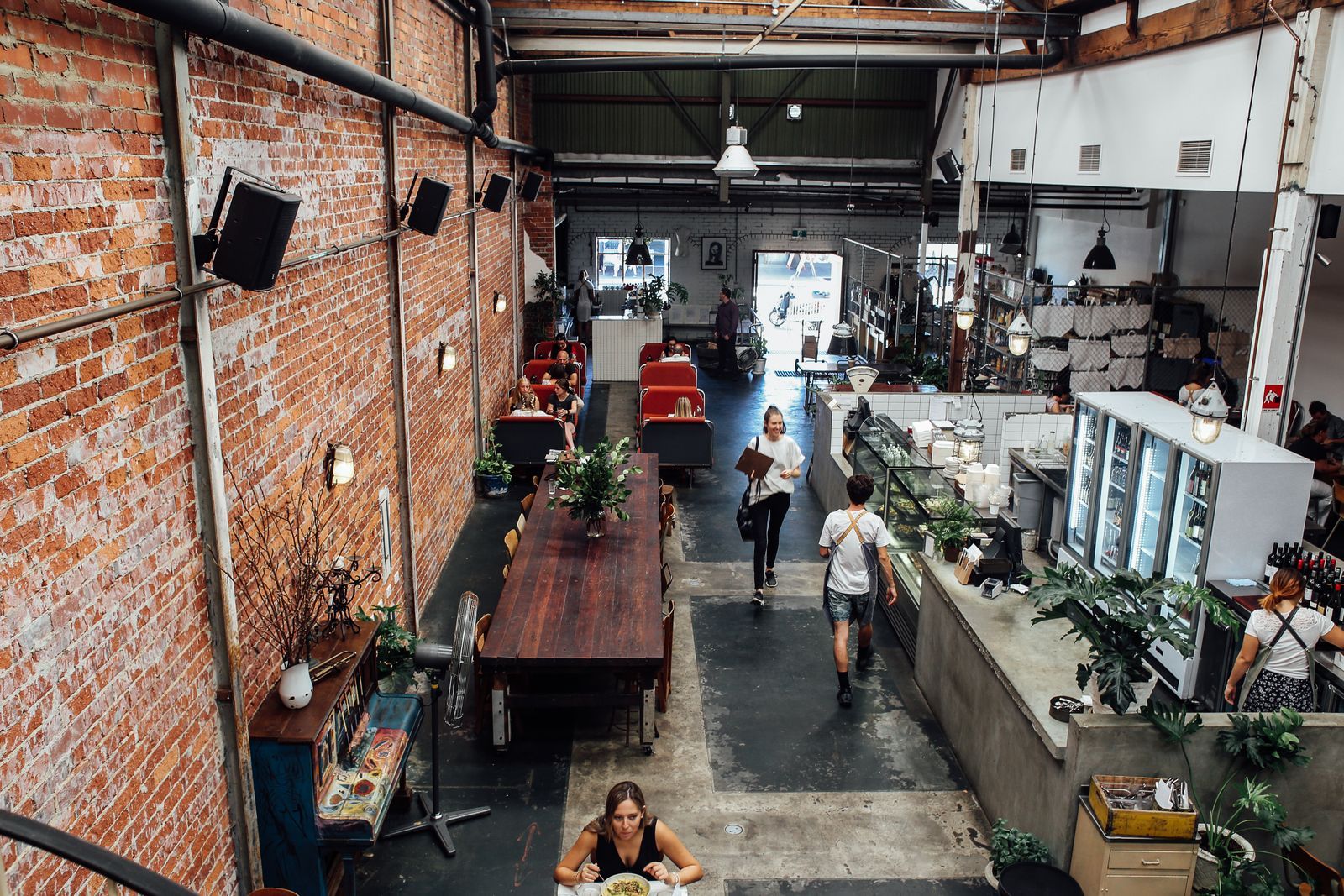A brick hall full of people